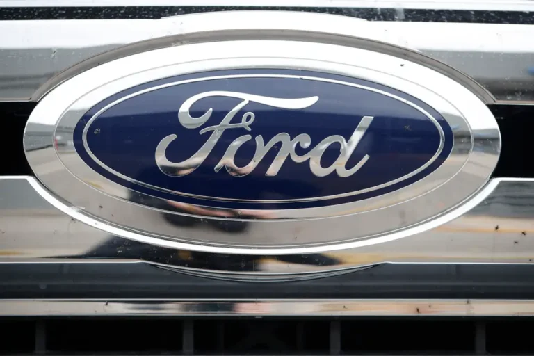 Ford cuts profit forecast as high costs and low volumes hit hard