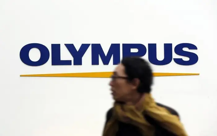 The CEO of optics giant Olympus has resigned after accusations he bought illegal drugs, sending its shares plummeting