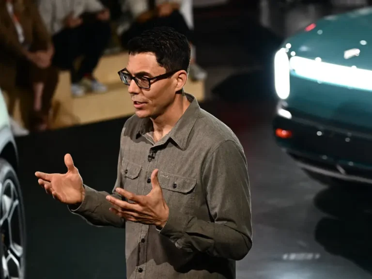 Rivian CEO says uncertainty over tariffs and elimination of EV credits contributed to carmaker’s lower guidance