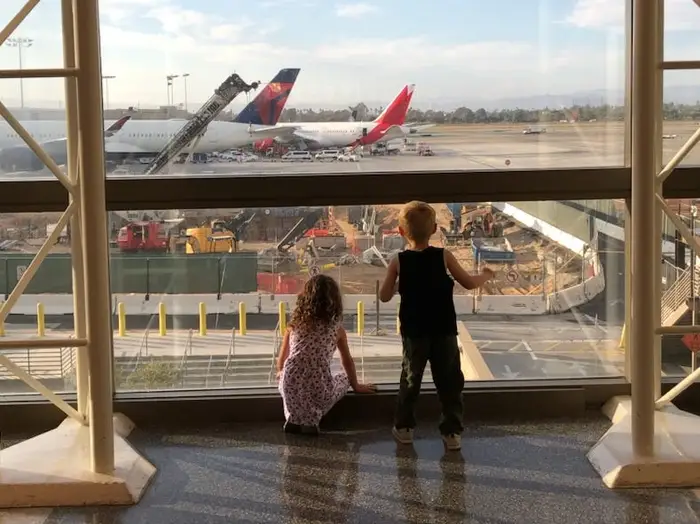 I didn’t fly with my twins until they were 2. I wish we’d started when their plane tickets would’ve been free.