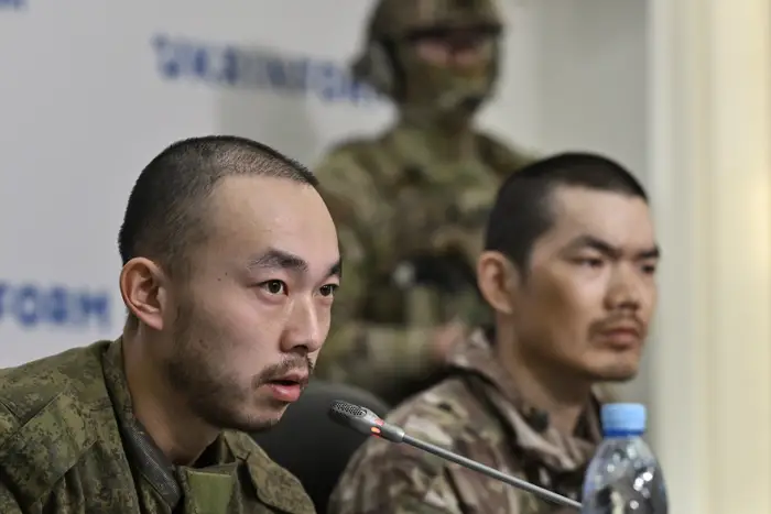 A Chinese man who said he fought for Russia said he couldn’t even go to the bathroom without an armed escort