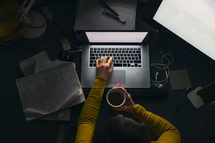 A Gen Xer making $300,000 secretly working 2 remote roles says the 12-hour days are worth the job security
