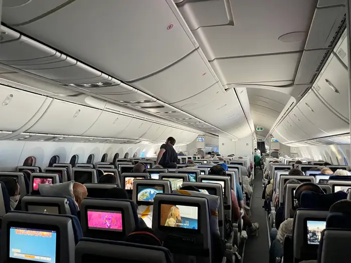 I sat in the front and back of economy for a round-trip long-haul flight. I’m still partial to the back.