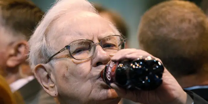 Warren Buffett defends his love of Coke and lack of exercise, noting that he’s still here at 94
