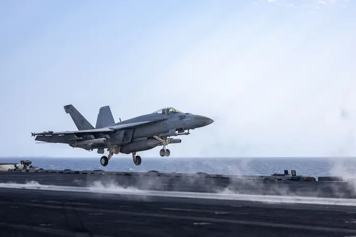 A US Navy sailor jumped from the cockpit of a Super Hornet just before the fighter jet fell off an aircraft carrier into the Red Sea
