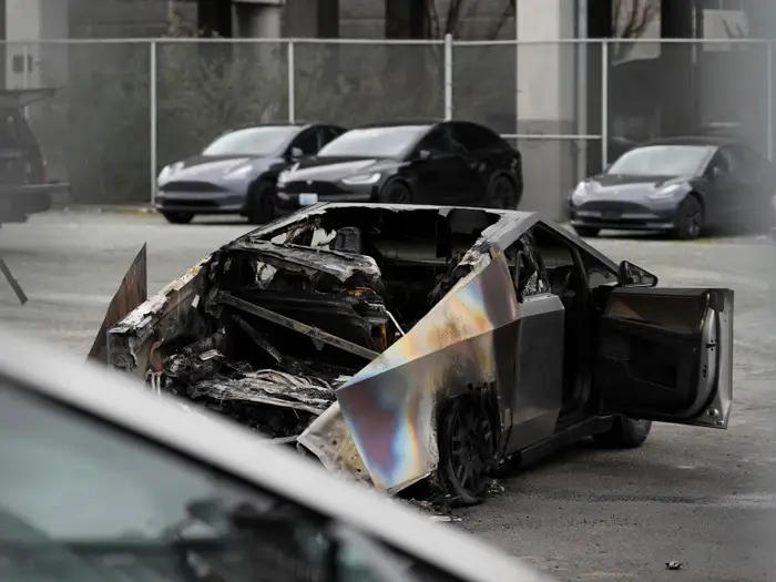 Suspected vandalism at Tesla dealerships has spanned at least a dozen states